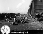 September 27, 1944  During WWII, long view of the south station, Liuchow, China, showing refugees packed atop freight cars in their attempt to flee the Japanese drive on Kweilin (Guilin).   Photo by Lt. N. J. Dain