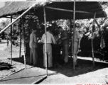 Enlisted men wash their mess kits in cans of scalding water at the Kurmitola Army Air Base in India in 1943.   In the CBI during WWII.