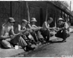 Enlisted men who have been fortunate enough to receive mail from home take time out to read their letters.  Kurmitola Army Air Base, India, 1943.  In the CBI during WWII.