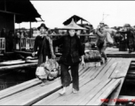 People crossing the floating bridge at Liuzhou during WWII.