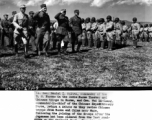 Troop review in Burma between Chinese and American officers and troops in 1945. Lt. Daniel I Sultan and Gen. Wei Li-huang return a salute as they review Chinese troops from Burma and China near Muse, China, after clearing Japanese troops from the Stillwell Road. 