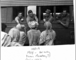 GIs in train from Bombay to Calcutta in 1944, talk to local men in India.  Photo by Syd Greenberg.