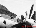 GIs work on a P-38 in Guangxi province, China, during WWII.