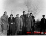 American GIs and a woman in the northern part of China, in cold weather. During WWII.