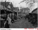 Market stall lining a small road in a Chinese village during WWII.  Photo from Malcolm J. Petzer.