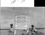 A crew of American GIs in front of a sign at Madras, India, during WWII, including Sandler (radio), Bell (Crew Chief), Lt. Miller, Capt. Conrad, and George Zdanoff.  Photo from George M. Zdanoff.