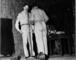 GIs prepare to perform during 54th Air Service Group entertainment, with instruments of the "Jive-o-Lieps" in the background. In the CBI during WWII.