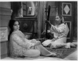 Purchased image with scene from an Indian movie.  Scenes in India witnessed by American GIs during WWII. For many Americans of that era, with their limited experience traveling, the everyday sights and sounds overseas were new, intriguing, and photo worthy.